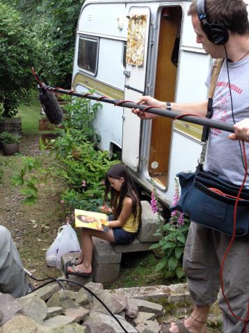 Girl outside caravan